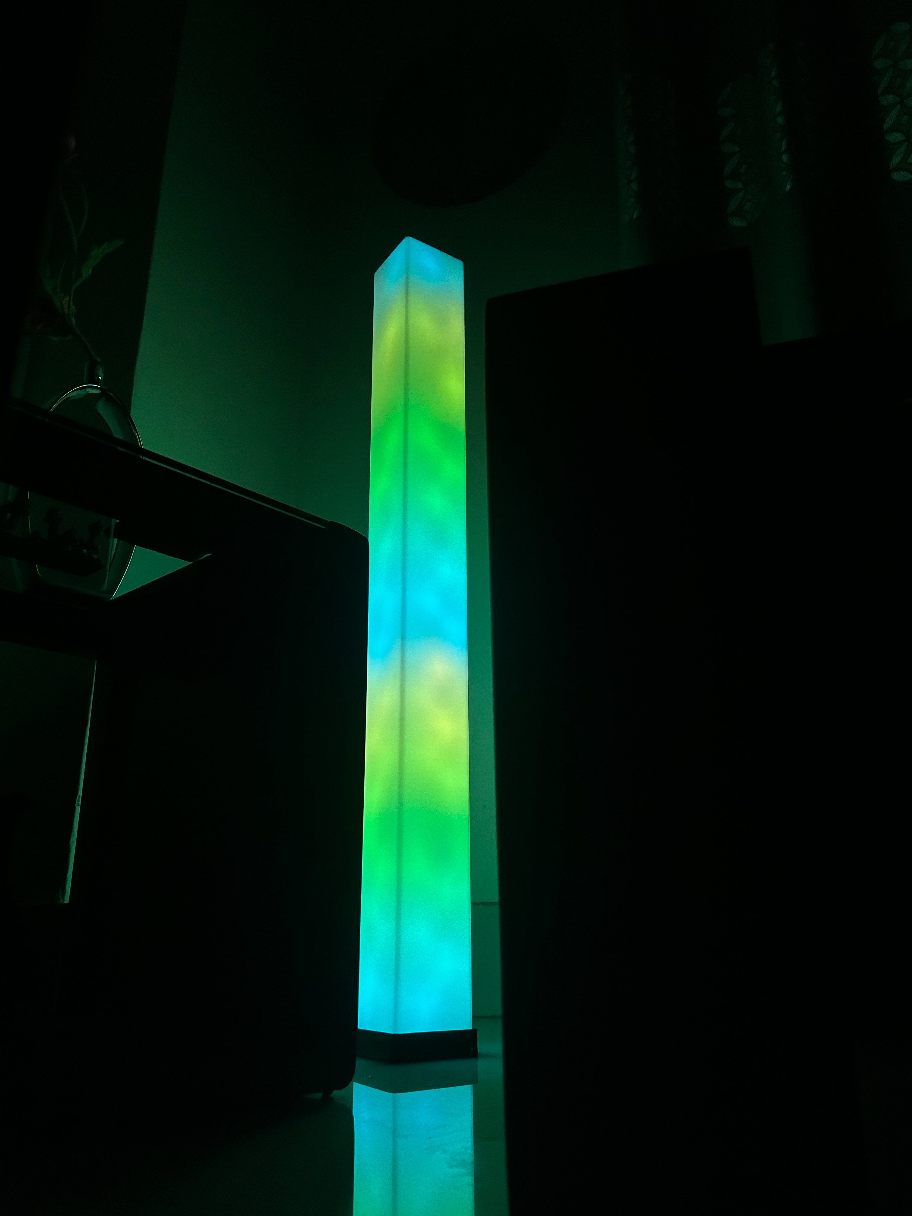 GLO FLOW Smart LED Lamp with 360° adjustable light and customizable colors for creating an immersive ambiance in any room.