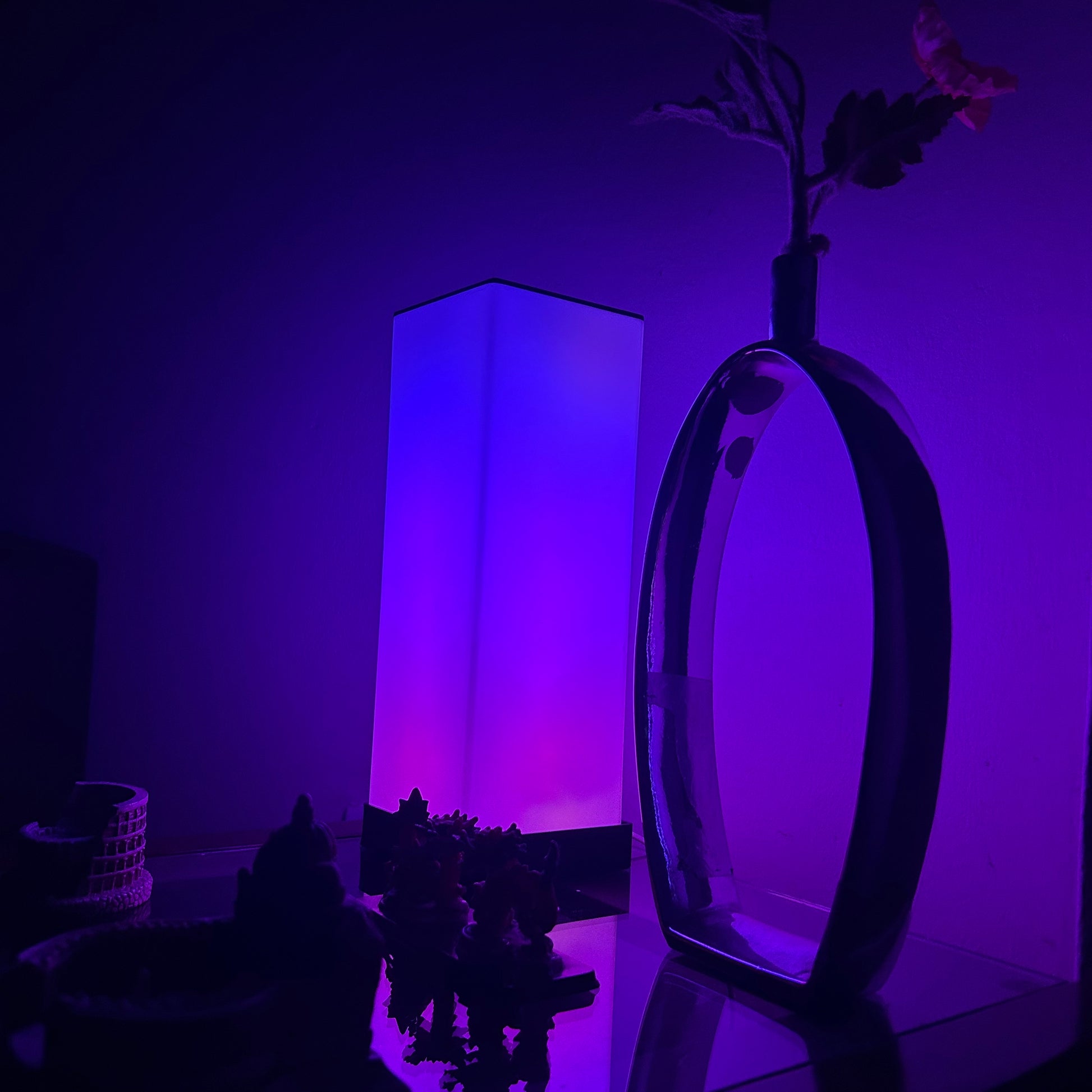 Compact FLOW Mini LED lamp with adjustable brightness and color options, perfect for small spaces and portable lighting needs.