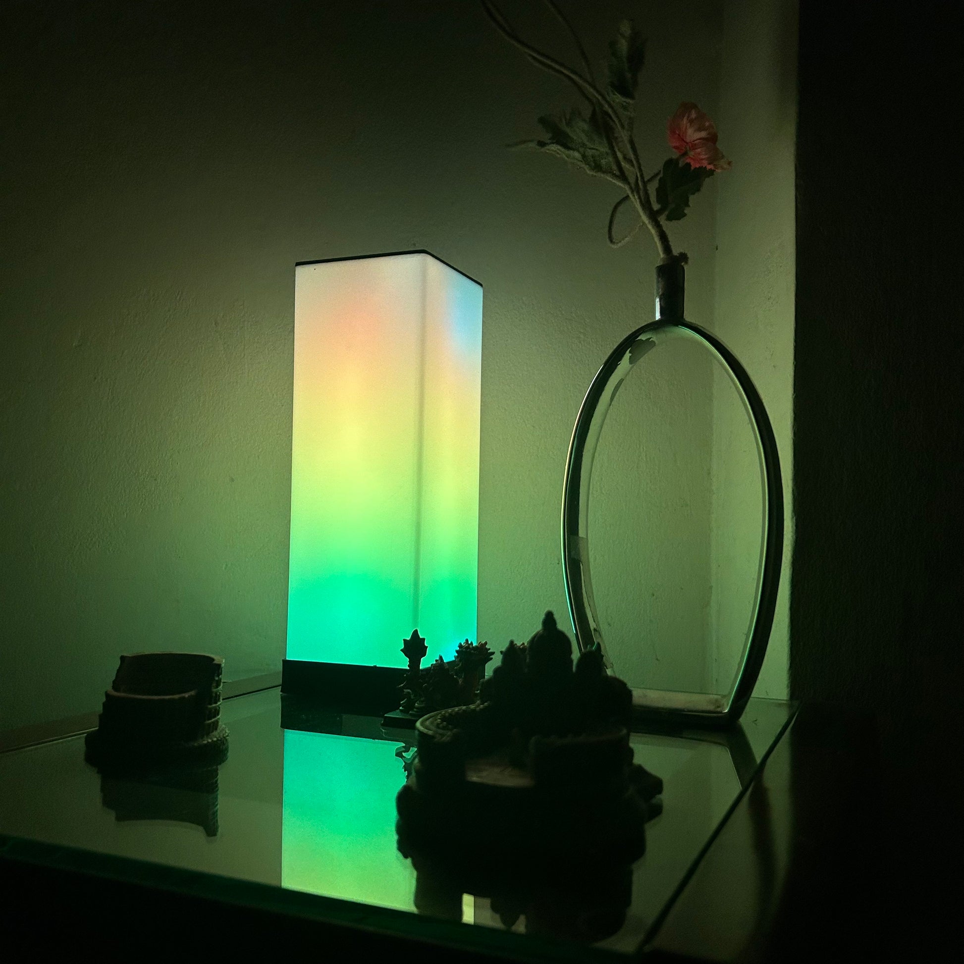 Compact FLOW Mini LED lamp with adjustable brightness and color options, perfect for small spaces and portable lighting needs.
