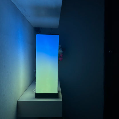 Compact FLOW Mini LED lamp with adjustable brightness and color options, perfect for small spaces and portable lighting needs.
