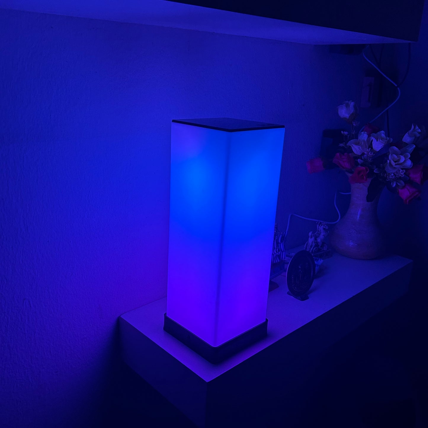 GLO Flow Mini compact RGB LED light with customizable color settings and app control