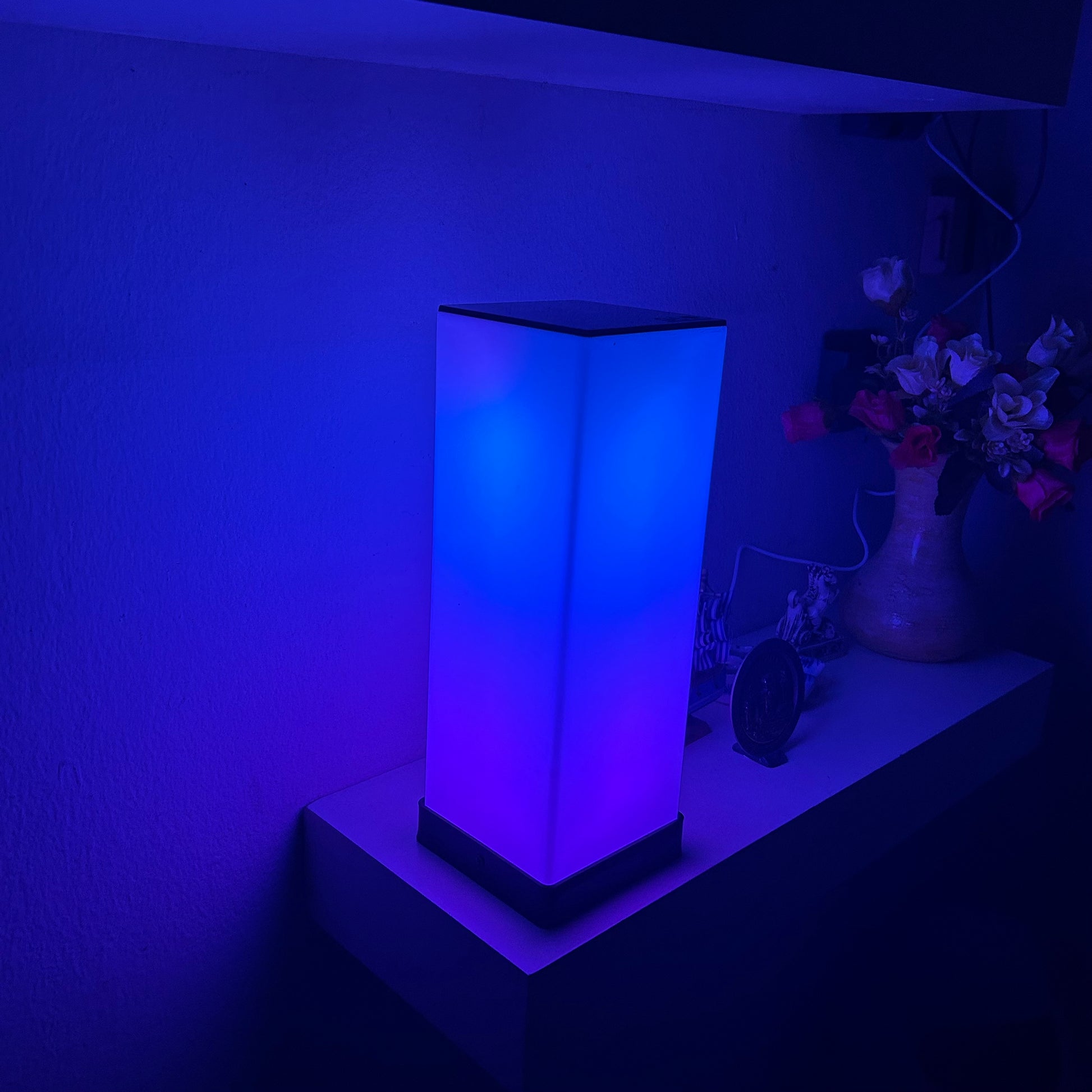 GLO Flow Mini compact RGB LED light with customizable color settings and app control